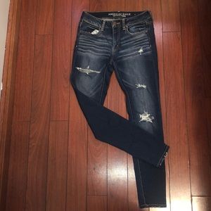 Distressed dark wash skinny jeans